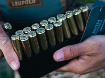 A man holds Hornady ammo.