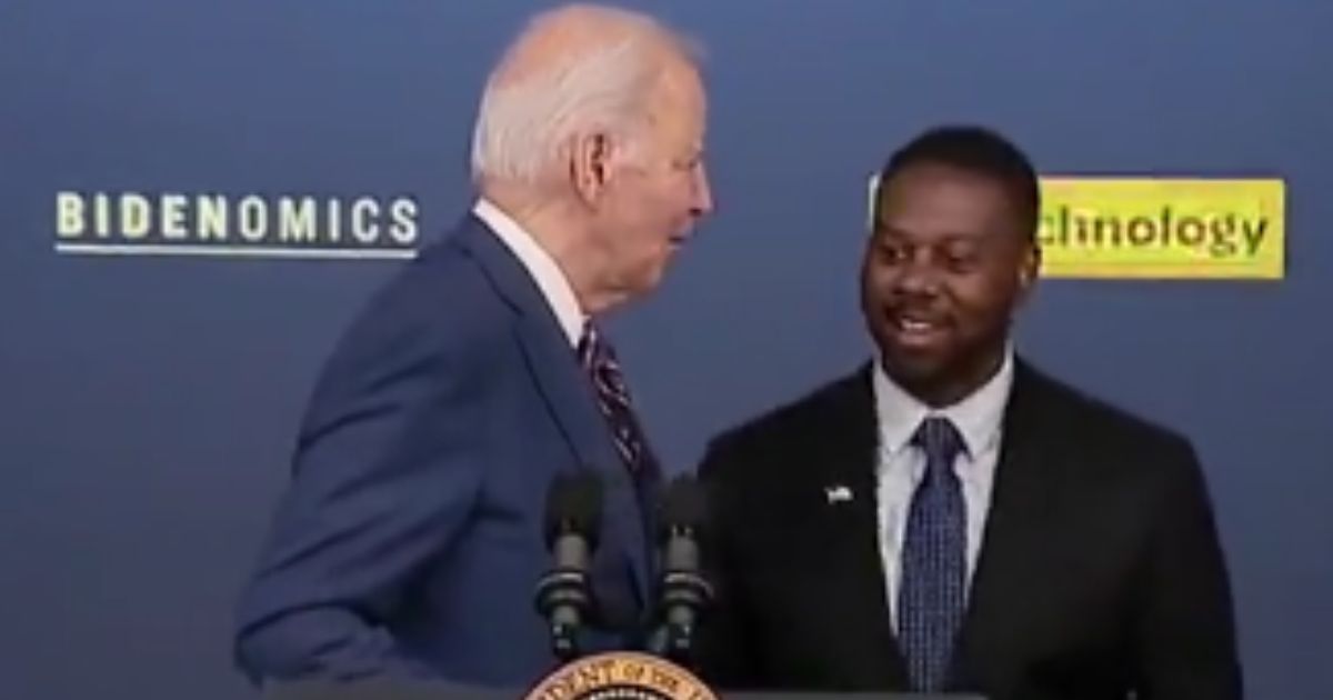 On Monday, Mark Anthony Thomas, right, was supposed to introduce President Joe Biden, left, before his speech, but Biden came out and started speaking before realizing his mistake.