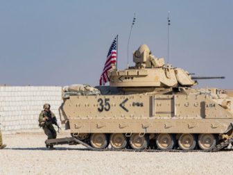 Soldiers assigned to the National Guard demonstrate capabilities with an M2A2 Bradley Fighting Vehicle for reporters in eastern Syria on Nov. 11, 2019.