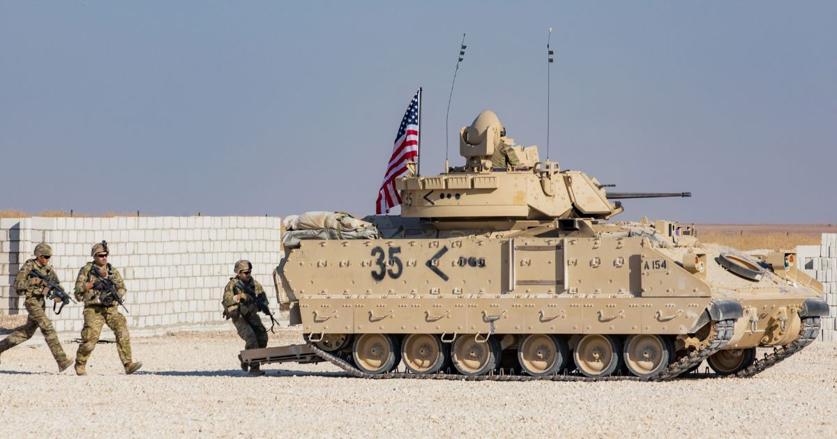 Soldiers assigned to the National Guard demonstrate capabilities with an M2A2 Bradley Fighting Vehicle for reporters in eastern Syria on Nov. 11, 2019.