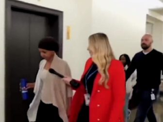 U.S. Rep. Ilhan Omar is questioned in a Capitol HIll hallway by Fox Business reporter Hillary Vaughn.