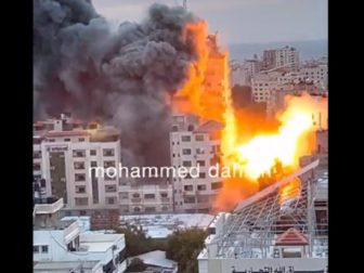 The Palestine Tower, a building that includes apartment a media offices in the Gaza Strip, is destroyed in an Israeli bombing Saturday.