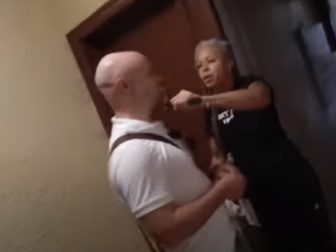 Shellyne Rodriguez, then a professor at Hunter College in New York, holds a blade to the throat of a New York Post reporter in a May video.