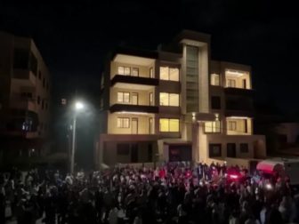 Protesters attempt to storm the Israeli embassy after the Gaza hospital explosion.