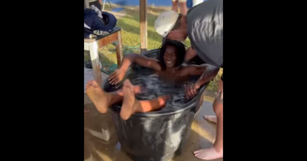 A member of the Tattnall County High School football team in Georgia is baptized after practice Oct. 23.