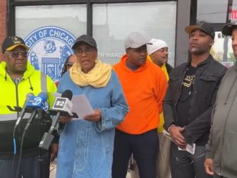 Chicago protesters read their demands to city officials.