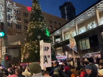 Pro-Palestinian protesters interrupt the Christmas tree lighting ceremony in Seattle on Friday.