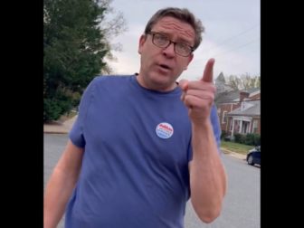 An angry man confronts a Republican poll worker in Arlington, Virginia, on Tuesday.