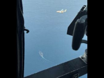 An Iranian drone is seen from a U.S. Navy helicopter.