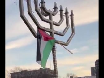 A Palestinian flag is seen on top of a menorah at Yale University.