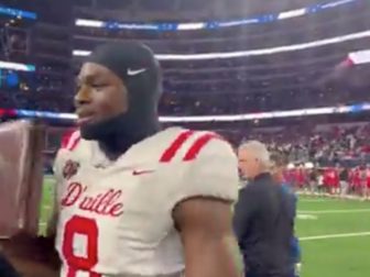 Five-star high school football prospect Colin Simmons is seen with a Bible.