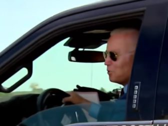 President Joe Biden is seen in a Ford electric F-150.