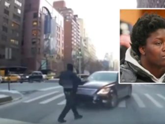 This still picture from a video shows a New York City police officer approaching a car as it reportedly was going the wrong way on Park Avenue on Wednesday. The officer was struck by the car, suffering a broken leg and multiple bruises. Sahara Dula, top right, was charged in the incident.