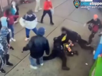 A gang of migrants attacks two New York City police officers on Saturday.