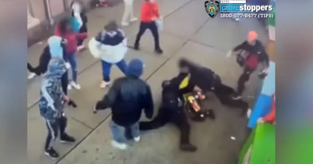 A gang of migrants attacks two New York City police officers on Saturday.