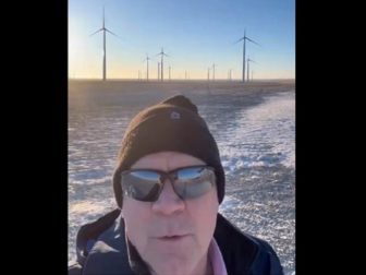 Republican Rep. Matt Rosendale in a still from a video of a visit to a wind turbine facility where none of the turbines are spinning.