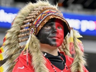 Holden Armenta became a national story last fall after an article in Deadspin labeled the young Kansas City Chiefs fan a racist for wearing war paint and a headdress to a game in Las Vegas. His family has now filed a lawsuit.