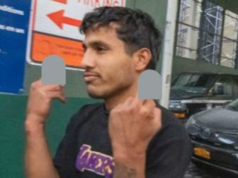 Jhoan Boada, one of the men suspected of attacking two NYPD officers in Times Square, "saluted" onlookers upon leaving court on Jan. 31. The charges against him have since been dropped.