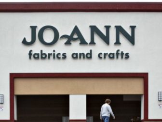 A woman walks into a Joann store in Davenport, Iowa, on Sept. 19, 2018.