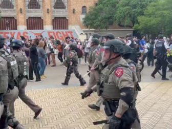 Law enforcement officers move in on protesters Wednesday at University of Texas in Austin.