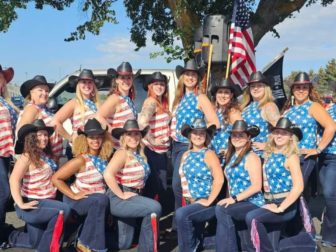 Members of the Borderline Dance Team are shown wearing American flag-themed shirts.