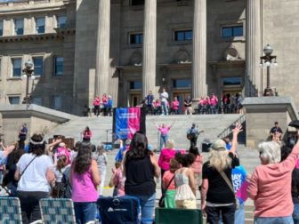 This image shows a crowd outside Idaho's capitol building attending a “Don’t Mess With Our Kids” prayer rally initiated by Her Voice Movement on Saturday.
