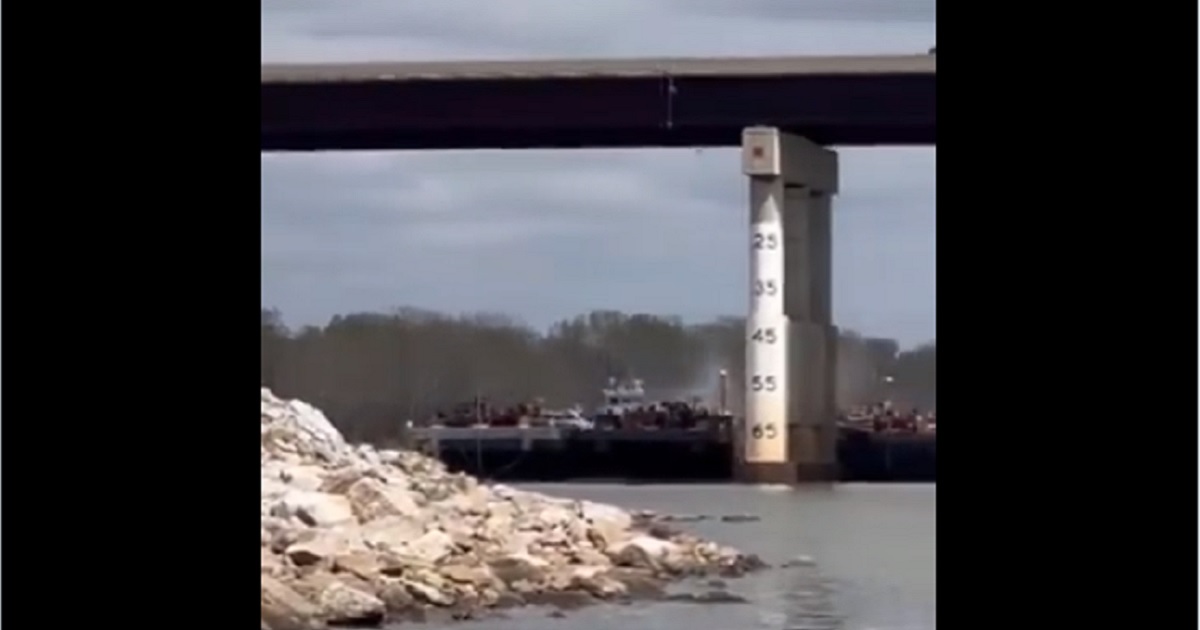 A barge strikes a bridge across the Arkansas River Saturday near Sallislaw, Oklahoma.