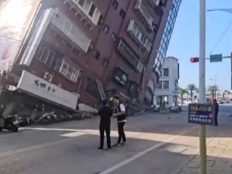 A building tilts to the point of collapse Wednesday in Hualien, Taiwan, after a powerful earthquake struck the country.
