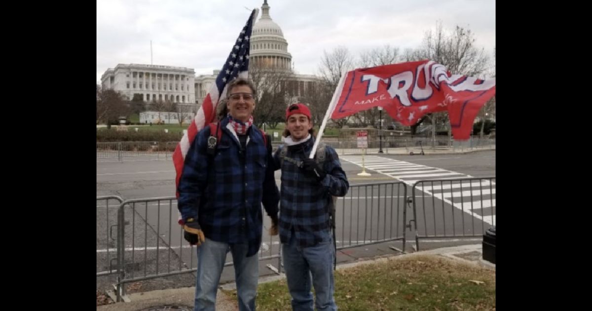 David Homol, left, and Dillon Homol, right, stand near the Capitol in Washington on Jan. 6, 2021.